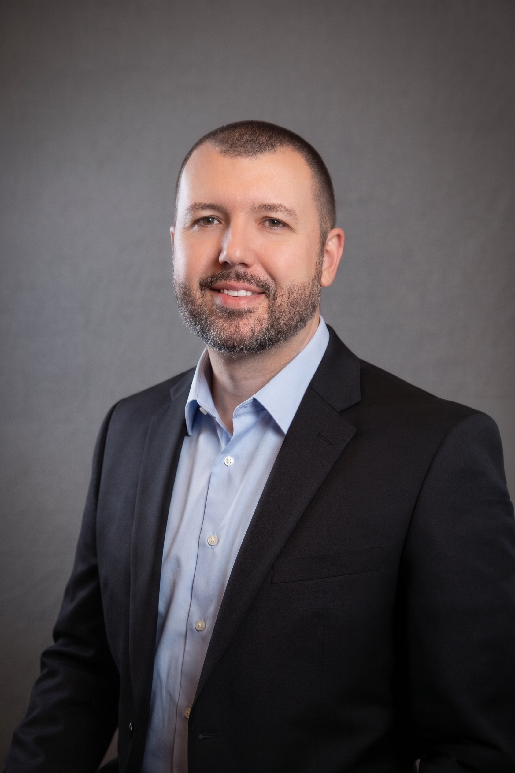 Professional portrait of a team member at aPowers Media.